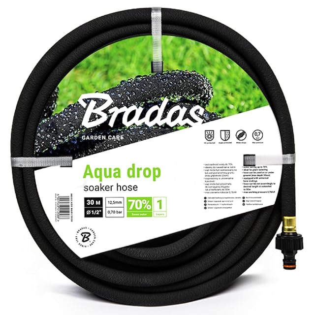 Black recycled rubber soaker hose in a coil